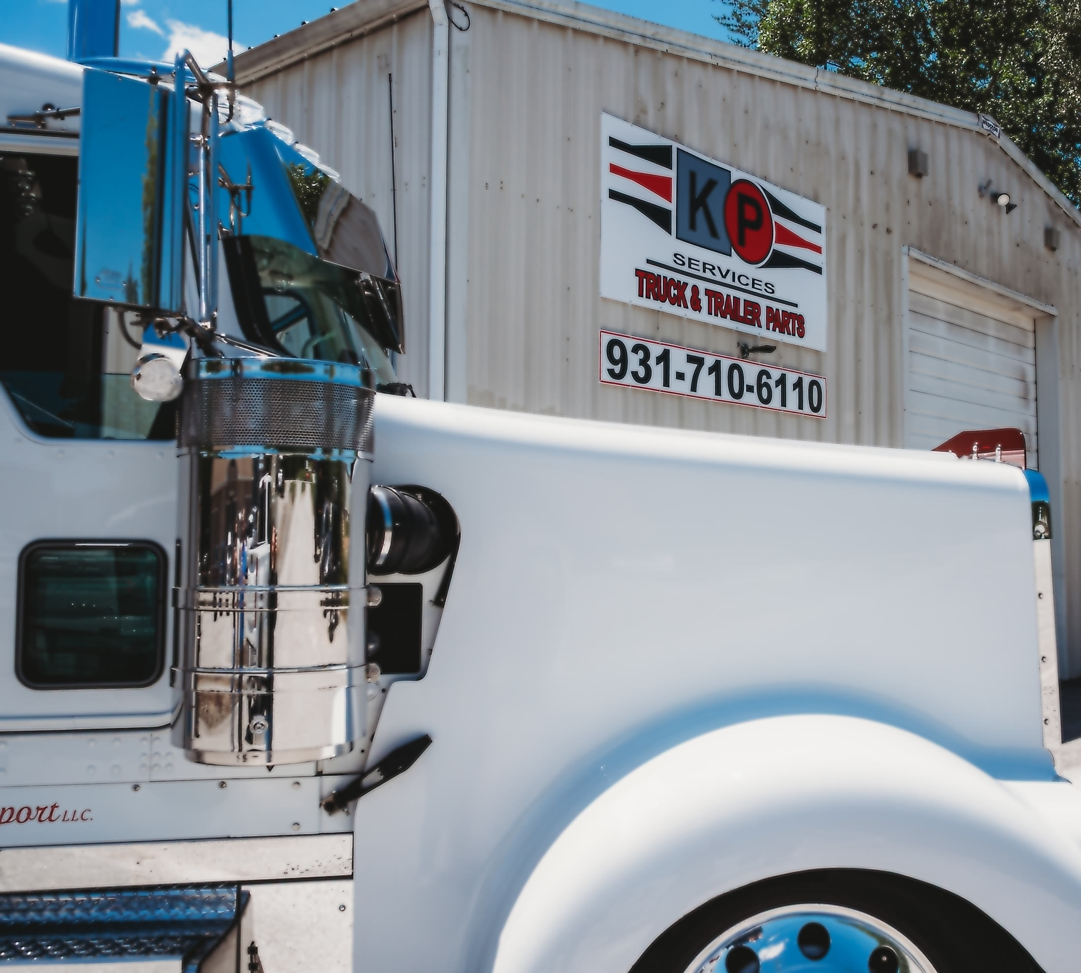 Customer truck at the KP Crossville Truck & Trailer Parts sign